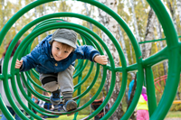 Child on play equipment