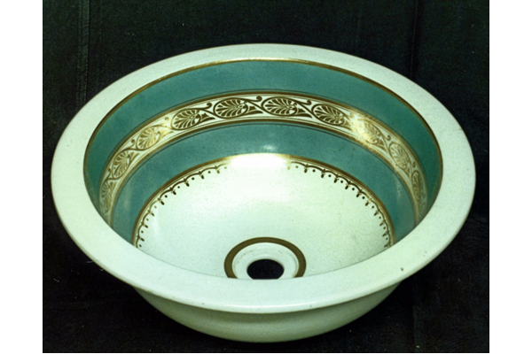 Late 19th century glazed ceramic wash basin manufactured by the Clyde Pottery, Greenock with hemispheric shape and plug hole in bottom. Dated circa 1877 - L1977.151 - © McLean Museum and Art Gallery, Greenock.