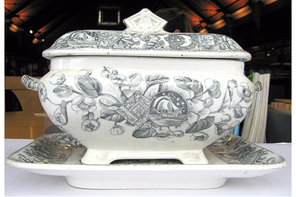 Late 19th century glazed ceramic tureen manufactured by the Clyde Pottery Company, Greenock. Decorated with the 'Mayflower' pattern showing a romanticised may-blossom with 'Mayflower' ship in reserves also heavenly bodies in geometric reserves. - 2001.22 - © McLean Museum and Art Gallery, Greenock.