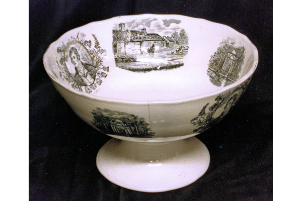Early 20th century glazed ceramic punch bowl manufactured by the Clyde Pottery Company Limited, Greenock 1900-1905. Decorated in white decorated with various images of the poet Robert Burns and scenes related to Burns, on inside and outside of bowl. - 1987.637 - © McLean Museum and Art Gallery, Greenock.