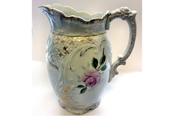 Late 19th century ceramic jug made by the Clyde Pottery Company (1862-1900) in 1897. Decorated withe 'Murray Rose' pattern. The jug is inscribed 'Mrs. Robert Bingham Married 29th Sept. 1897'. - 2012.64 - © McLean Museum and Art Gallery, Greenock.