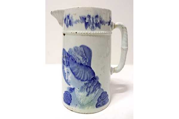 Jug manufactured by the Clyde Pottery Company, Greenock. Decorated with the 'Sylph' pattern showing the head of an 1890s young woman wearing a poke bonnet. Purchased with grant-aid from the National Fund for Acquisitions. - 1987.690