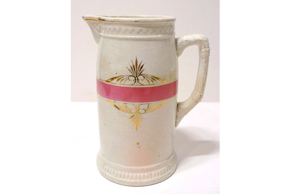 Glazed ceramic jug manufactured by the Clyde Pottery Company, Greenock. Decorated with pink stripe and gilding. Purchased with grant-aid from the National Fund for Acquisitions. - 1987.691 - © McLean Museum and Art Gallery, Greenock.