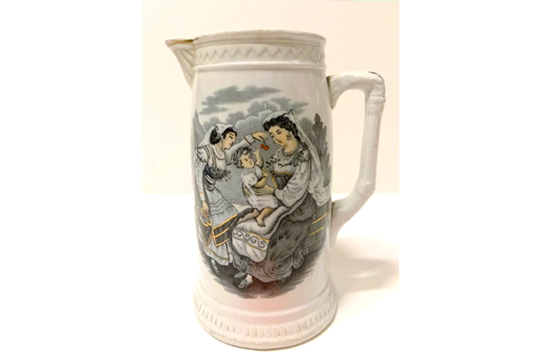 Ceramic jug manufactured by the Clyde Pottery Company, Greenock. Decorated with the 'Cherry Ripe' pattern of an Italian lady dangling a cherry in front of a child. The Cherry Ripe pattern was produced from 1875 onwards. Purchased with grant-aid from the National Fund for Acquisitions. - 1987.692