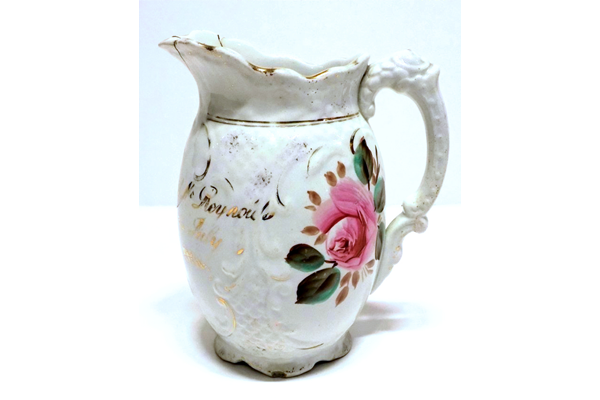 Marriage jug manufactured by the Clyde Pottery Company Limited, Greenock 1900-1905. Decorated with the 'Murray Rose' pattern and inscribed 'Mr & Mrs Joseph McReynolds Married 2nd July 1901'. - 1997.111 - © McLean Museum and Art Gallery, Greenock.
