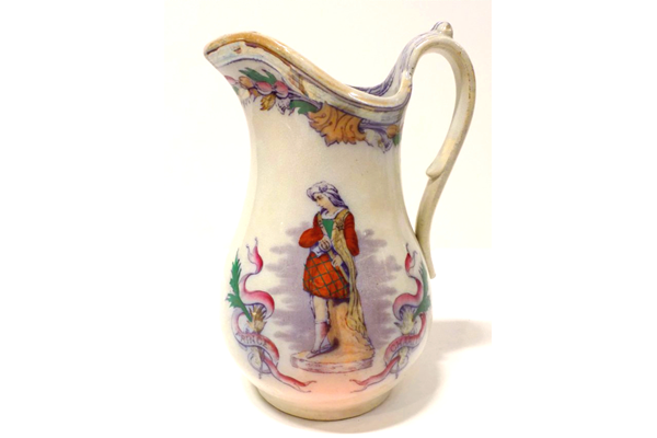 Jug manufactured by the Clyde Pottery Company, Greenock. Decorated with the 'Bonnie Prince Charlie' pattern showing the prince, wearing a kilt, in a surround of thistles and heather. - 1981.1593 - © McLean Museum and Art Gallery, Greenock.