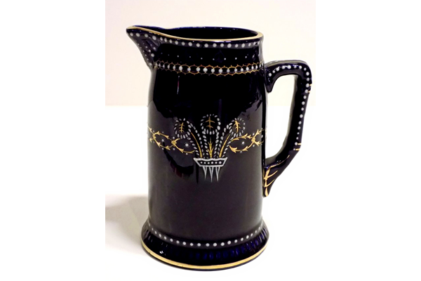 Jug manufactured by the Clyde Pottery Company, Greenock and decorated with the Mazarine Blue pattern ware with Prance of Wales' feather pattern. - L1977.164 - © McLean Museum and Art Gallery, Greenock.
