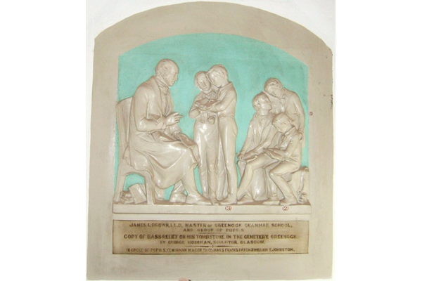 This bas-relief is a copy of James Lockhart Brown's tombstone in Greenock cemetery by George Mossman. Brown was Master of Greenock Grammar School and the pupils shown includes the artist Norman MacBeth (1847-1891) and James Fraser Paton (1865-1928), the son of Allan Park Paton- 1978.271 - ©McLean Museum and Art Gallery, Greenock.