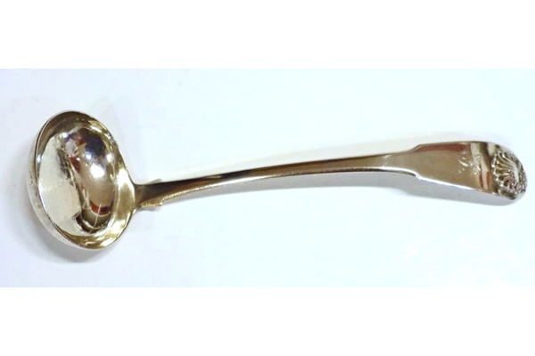 Silver toddy ladle with a fiddle and shell pattern engraved with the initial 'S'. Oval bowl with drop heel. Made by John Heron (fl 1815-1830), in 1824 with five marks: maker's name 'Heron' and four Edinburgh marks: king's head, castle, thistle and date mark 's' for 1824. One of a pair of ladles. - 1982.1 - ©McLean Museum and Art Gallery, Greenock.