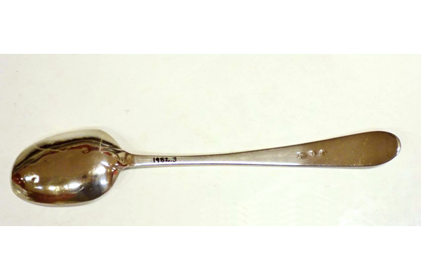 Silver dessert spoon made by Jonas Osborn (fl 1790). Old English style with engraved initial 'J' and drop hell. Three marks: 'I.O.' (Jonas Osborne), an anchor and capital letter 'G' the date mark for 1790. - 1982.3 - ©McLean Museum and Art Gallery, Greenock.