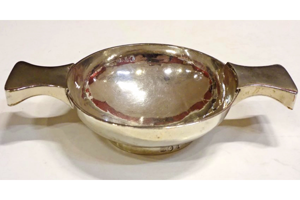 Greenock provincial silver quaich made by Nathaniel Hunter (fl 1775-1834). Two handles and plain design. Hallmarked 'NH' on side of base. - 2001.6 - ©McLean Museum and Art Gallery, Greenock.