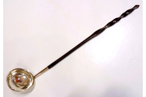 Early nineteenth century Greenock provincial silver punch ladle made by John Heron (fl 1815-1830). The ladle has a twisted whalebone handle and bears marks 'JH', oak tree, anchor & 'C'. - 2001.286 - ©McLean Museum and Art Gallery, Greenock.