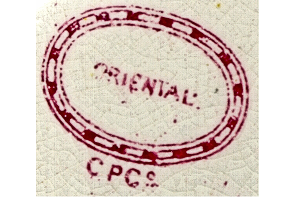 Using a design similar to 'Indian Tree' printed in black or red/brown, sepia flow-blue on jugs and punchbowls, often with a hand painted overglaze. Pattern name in oval C.P.Co. under. © McLean Museum and Art Gallery, Greenock.