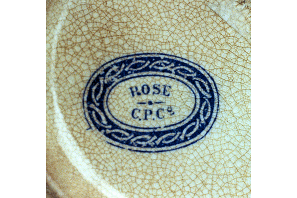 The Rose pattern shows a little girl at a window with distant scene in the background. She is feeding a cat. Found on jugs with the pattern name over dotted line over C.P.Co. in oval. © McLean Museum and Art Gallery, Greenock.