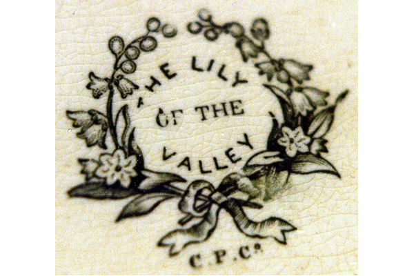 Lily of the Valley in centre and border, often picked out in hand painted overglaze. Widely used on punch-bowls, toilet seats and wall plaques. Usually marked C.P.Co. but sometimes seen with a sailing yacht mark. © McLean Museum and Art Gallery, Greenock.