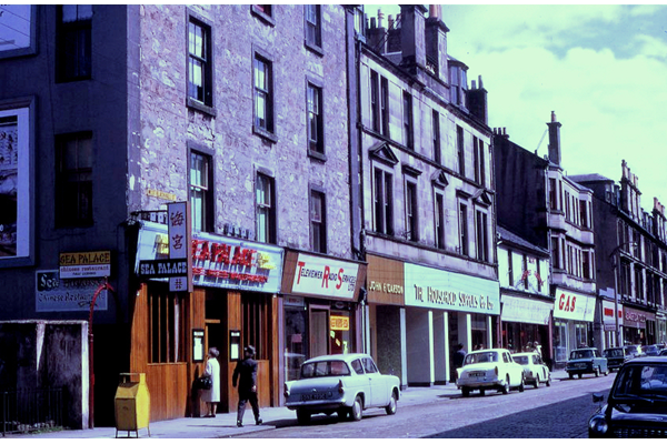 Transparency taken by Eugene Jean Méhat (1920-2000) showing a view of West Blackhall Street, Greenock in the 1960s with the Sea Palace Chinese restaurant and Televiewer shop. - 2008.72.86 - © McLean Museum and Art Gallery, Greenock.