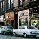 Shops in West Blackhall Street, Greenock.  This colour transparency was taken by Eugene Jean Méhat (1920-2000) in 1967. - 2008.72.615  - © McLean Museum and Art Gallery, Greenock.