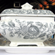 Late 19th century glazed ceramic tureen manufactured by the Clyde Pottery Company, Greenock. Decorated with the 'Mayflower' pattern showing a romanticised may-blossom with 'Mayflower' ship in reserves also heavenly bodies in geometric reserves. - 2001.22 - © McLean Museum and Art Gallery, Greenock.