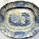 A late 19th century large glazed ceramic ashet or serving plate manufactured by the Clyde Pottery Company of Greenock (1862-1900). Decorated in blue with the 'British Rivers' pattern. - 2012.65 - © McLean Museum and Art Gallery, Greenock.