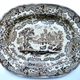 Early 19th century glazed ceramic ashet or serving plate manufactured by the Clyde Pottery Company, Greenock (1814-1841) (James and Andrew Muir). Decorated with the 'British Rivers' pattern in brown. Many British potteries produced 'series' of pictures on their wares. These were usually copied from engravings in late eighteenth or early nineteenth century travel books. - 1987.647