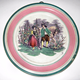 Late 19th century glazed ceramic plaque, manufactured by the Clyde Pottery Company, Greenock. This was an apprentice piece made by Jean Gray (Mary Jane Gray). Green and pink bands bordering a central pastoral picture of female figure, garden male figure standing with horse. - 1990.174 - © McLean Museum and Art Gallery, Greenock.