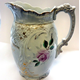 Late 19th century ceramic jug made by the Clyde Pottery Company (1862-1900) in 1897. Decorated withe 'Murray Rose' pattern. The jug is inscribed 'Mrs. Robert Bingham Married 29th Sept. 1897'. - 2012.64 - © McLean Museum and Art Gallery, Greenock.
