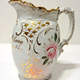 Glazed ceramic marriage jug manufactured by the Clyde Pottery Company, Greenock. Decorated with the 'Murray Rose' pattern and inscribed 'Mrs David McEwing Married March 9th 1898'. - 1980.109 - © McLean Museum and Art Gallery, Greenock.