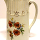 Marriage milk jug manufactured by the Clyde Pottery Company, Greenock. Floral design, escalloped edging and inscribed 'A present to Mr & Mrs Gemmell, married 31 Dec 1895' - 1997.114 - © McLean Museum and Art Gallery, Greenock.