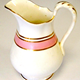 Milk jug manufactured by Thomas Shirley & Co. (the Clyde Pottery Company, Greenock) sometime between 1844 and 1857. Decorated in white with pink stripe and gilded decoration. - 2001.294 - © McLean Museum and Art Gallery, Greenock.