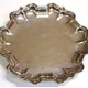 Mid eighteenth century Greenock provincial silver waiter made by John Taylor (fl 1750-1785). The waiter has a circular, fluted edge with points. Four hallmarks on underside at edge: 'IT', 'S', 'S' and 'IT'.  -  2001.5 - ©McLean Museum and Art Gallery, Greenock.