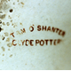 This pattern and mark are found on a great variety of ware, but mainly punch bowls and wall plaques. Mark is TAM O'SHANTER, curved over CLYDE POTTERY. © McLean Museum and Art Gallery, Greenock.