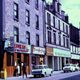 Transparency taken by Eugene Jean Méhat (1920-2000) showing a view of West Blackhall Street, Greenock in the 1960s with the Sea Palace Chinese restaurant and Televiewer shop. - 2008.72.86  - © McLean Museum and Art Gallery, Greenock.